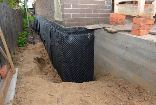 SJ Waterproofing Pros technician performing targeted Waterproofing assessment in Lansing, MI